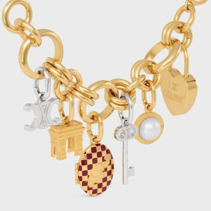 Anhänger „Triomphe Key“ aus Messing mit Rhodium-Finish Anhänger „Triomphe Key“ aus Messing mit Rhodium-Finish