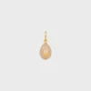 Anhänger „Stone Egg“ aus Botticino und Messing mit Goldfinish Anhänger „Stone Egg“ aus Botticino und Messing mit Goldfinish
