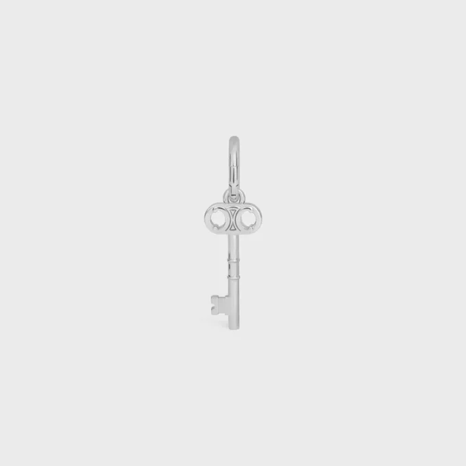 Anhänger „Triomphe Key“ aus Messing mit Rhodium-Finish Anhänger „Triomphe Key“ aus Messing mit Rhodium-Finish