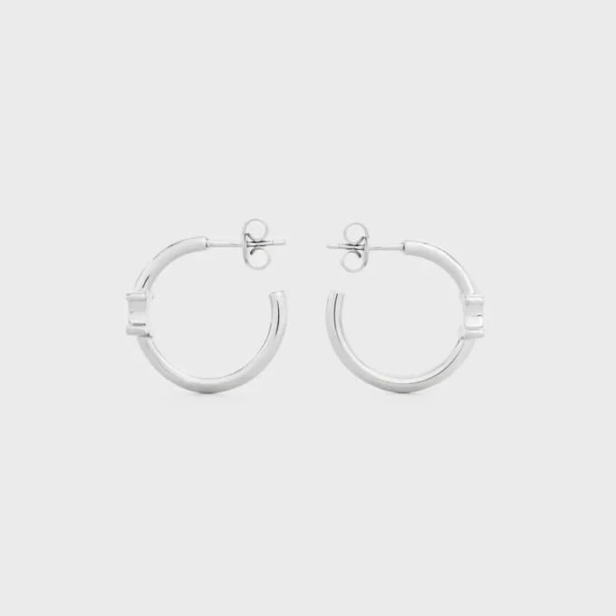 Asymmetrische Triomphe-Creolen aus Messing mit Rhodium-Finish Asymmetrische Triomphe-Creolen aus Messing mit Rhodium-Finish