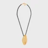 CELINE Dafila Muschel-Halskette aus Messing mit Goldfinish und Seide CELINE Dafila Muschel-Halskette aus Messing mit Goldfinish und Seide