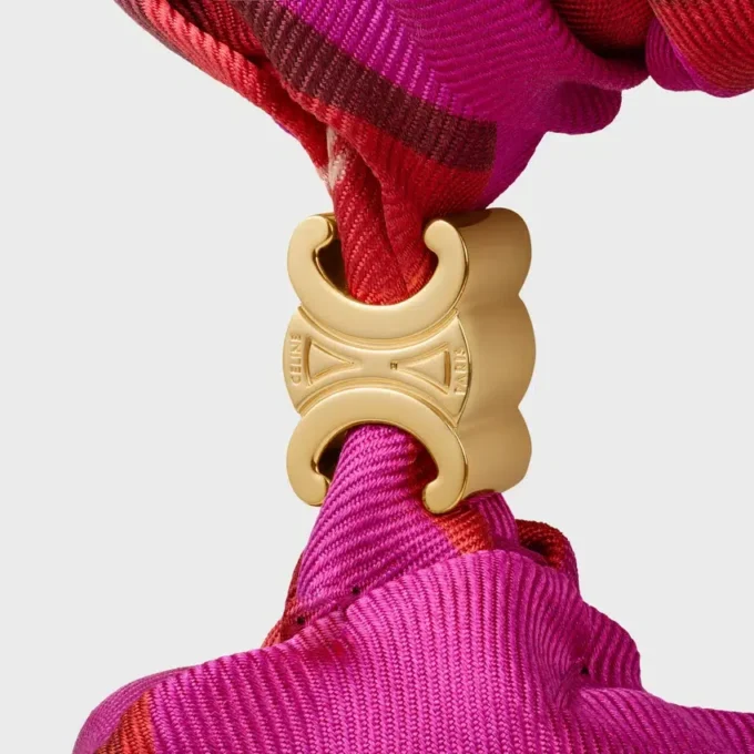 CELINE gewebtes Haargummi aus Seide und Messing mit Goldfinish CELINE gewebtes Haargummi aus Seide und Messing mit Goldfinish