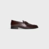 CELINE Malaquais Penny Triomphe Loafer aus poliertem Stierleder CELINE Malaquais Penny Triomphe Loafer aus poliertem Stierleder