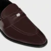 CELINE Malaquais Penny Triomphe Loafer aus poliertem Stierleder CELINE Malaquais Penny Triomphe Loafer aus poliertem Stierleder