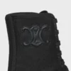 CELINE voluminöser Schnürstiefel aus Nylon und glänzendem Stierleder CELINE voluminöser Schnürstiefel aus Nylon und glänzendem Stierleder