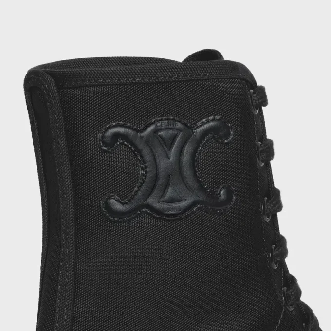 CELINE voluminöser Schnürstiefel aus Nylon und glänzendem Stierleder CELINE voluminöser Schnürstiefel aus Nylon und glänzendem Stierleder