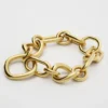 Charms Modernes, schmales Gourmette-Armband aus Messing mit Goldfinish