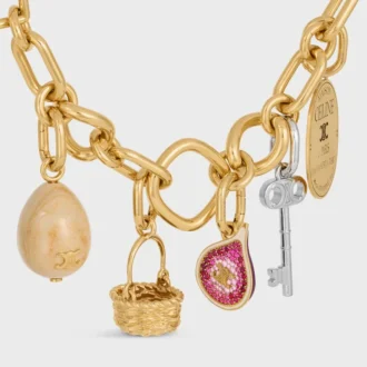 Anhänger in Form einer Feige aus Messing mit Goldfinish, Emaille und Strass