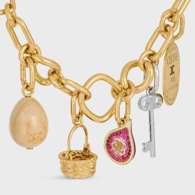 Anhänger in Form einer Feige aus Messing mit Goldfinish, Emaille und Strass Anhänger in Form einer Feige aus Messing mit Goldfinish, Emaille und Strass