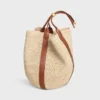 Große Beuteltasche aus Raffia und Kalbsleder Große Beuteltasche aus Raffia und Kalbsleder