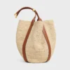 Große Beuteltasche aus Raffia und Kalbsleder Große Beuteltasche aus Raffia und Kalbsleder