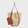 Große Beuteltasche aus Raffia und Kalbsleder Große Beuteltasche aus Raffia und Kalbsleder