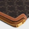 Lange Tasche mit Riemen aus Triomphe Canvas und Kalbsleder Lange Tasche mit Riemen aus Triomphe Canvas und Kalbsleder