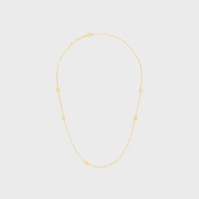 Les Perles CELINE Halskette aus Strass, Kunstharzperlen und Messing mit Goldfinish Les Perles CELINE Halskette aus Strass, Kunstharzperlen und Messing mit Goldfinish