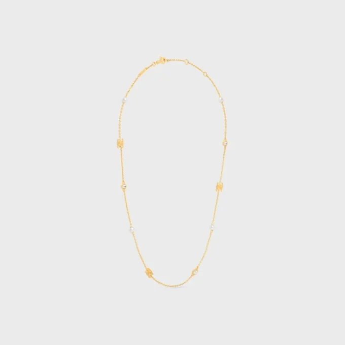 Les Perles CELINE Halskette aus Strass, Kunstharzperlen und Messing mit Goldfinish Les Perles CELINE Halskette aus Strass, Kunstharzperlen und Messing mit Goldfinish