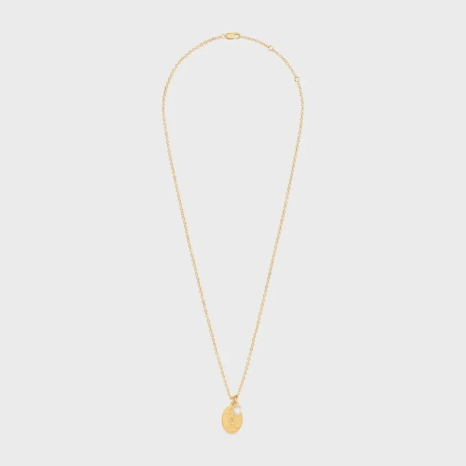 Les Perles CELINE Medaillon-Halskette aus Kunstharzperlen und Messing mit Goldfinish Les Perles CELINE Medaillon-Halskette aus Kunstharzperlen und Messing mit Goldfinish