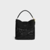 Mittlere Louise-Beuteltasche aus Raffia und Kalbsleder Mittlere Louise-Beuteltasche aus Raffia und Kalbsleder