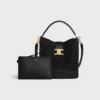 Mittlere Louise-Beuteltasche aus Raffia und Kalbsleder Mittlere Louise-Beuteltasche aus Raffia und Kalbsleder
