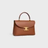 Mittlere Nino-Tasche aus geschmeidigem genarbtem Kalbsleder Mittlere Nino-Tasche aus geschmeidigem genarbtem Kalbsleder