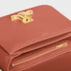 Teen Triomphe Tasche aus glänzendem Kalbsleder Teen Triomphe Tasche aus glänzendem Kalbsleder