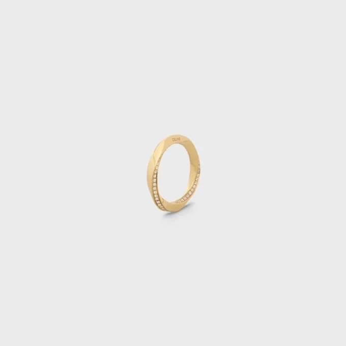 Torsion-Ring aus Gelbgold und Diamanten