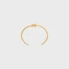 Triomphe Asymmetrische Manschette aus Messing mit Goldfinish Triomphe Asymmetrische Manschette aus Messing mit Goldfinish