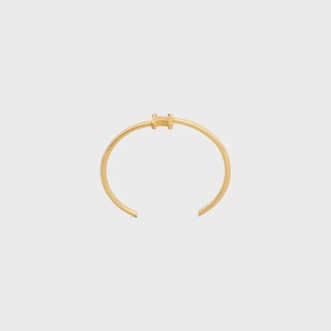 Triomphe Asymmetrische Manschette aus Messing mit Goldfinish Triomphe Asymmetrische Manschette aus Messing mit Goldfinish