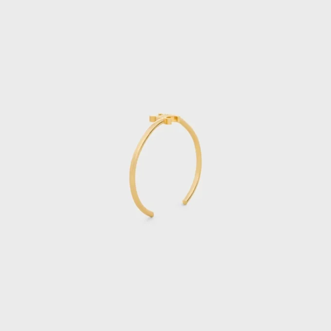 Triomphe Asymmetrische Manschette aus Messing mit Goldfinish Triomphe Asymmetrische Manschette aus Messing mit Goldfinish