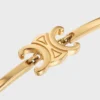 Triomphe-Gelenkarmband aus Messing mit Goldfinish Triomphe-Gelenkarmband aus Messing mit Goldfinish