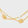 Triomphe Pearl Doppelkette aus Messing mit Goldfinish und Kunstharzperlen Triomphe Pearl Doppelkette aus Messing mit Goldfinish und Kunstharzperlen