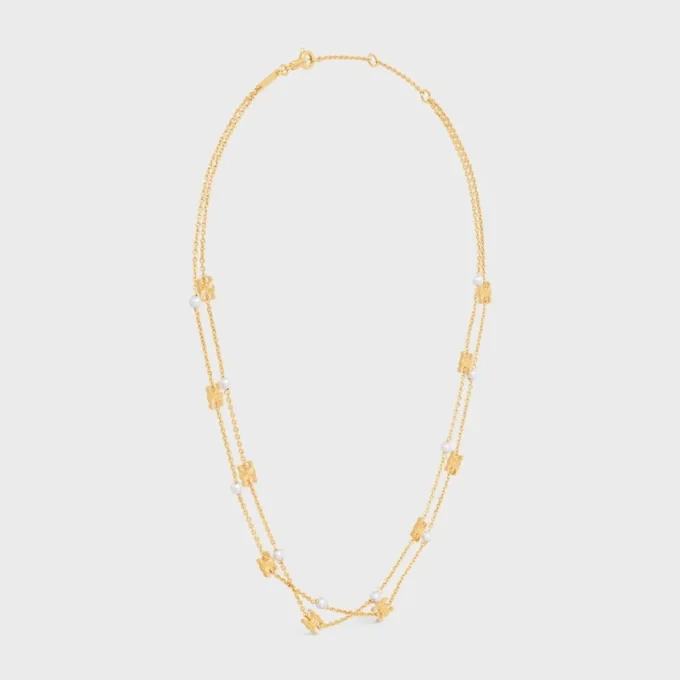 Triomphe Pearl Doppelkette aus Messing mit Goldfinish und Kunstharzperlen Triomphe Pearl Doppelkette aus Messing mit Goldfinish und Kunstharzperlen