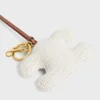 Triomphe Pom-Pom-Schlüsselanhänger aus gehäkelter Baumwolle mit Goldverzierung Triomphe Pom-Pom-Schlüsselanhänger aus gehäkelter Baumwolle mit Goldverzierung