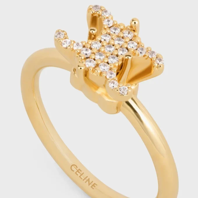 Triomphe Solitaire Sparkle Ring aus Strass und Messing mit Goldfinish Triomphe Solitaire Sparkle Ring aus Strass und Messing mit Goldfinish