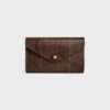 Umschlagbrieftasche an Kette aus Pythonleder Umschlagbrieftasche an Kette aus Pythonleder