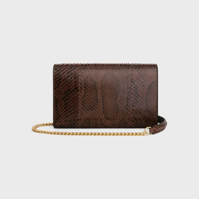 Umschlagbrieftasche an Kette aus Pythonleder Umschlagbrieftasche an Kette aus Pythonleder