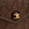 Umschlagbrieftasche an Kette aus Pythonleder Umschlagbrieftasche an Kette aus Pythonleder